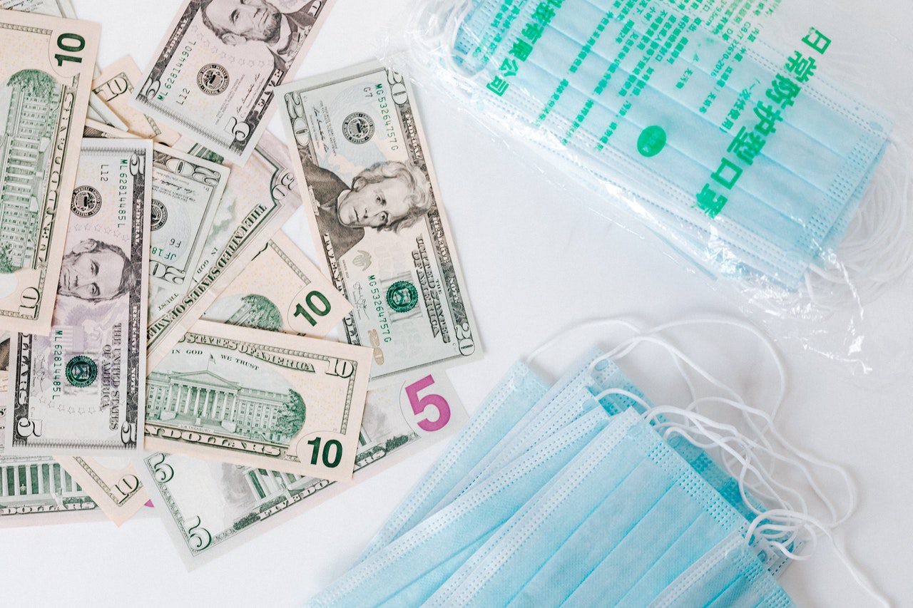 dollar-bills-and-healthcare-masks