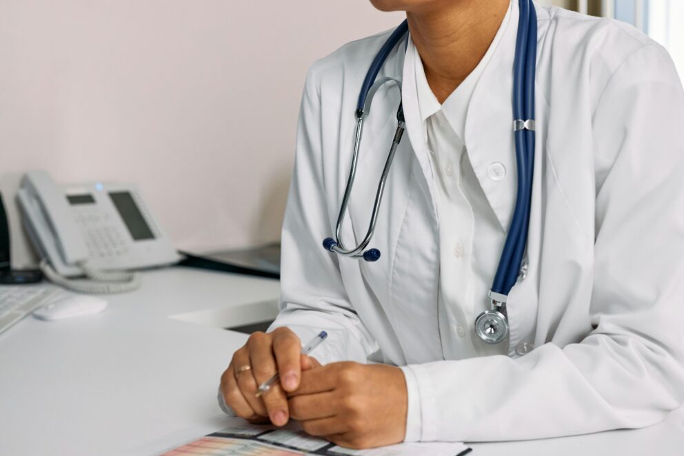 nurse practitioner listening to patient